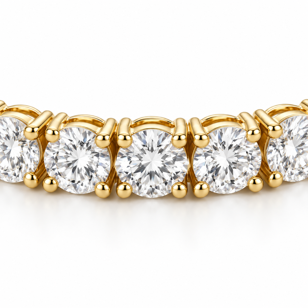 Close detail of round lab-grown diamonds and four-prong links on the 14K gold tennis bracelet.