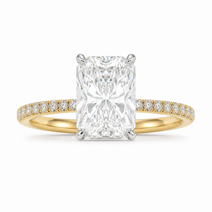 Front view of 4 carat elongated radiant diamond ring with pavé yellow gold band
