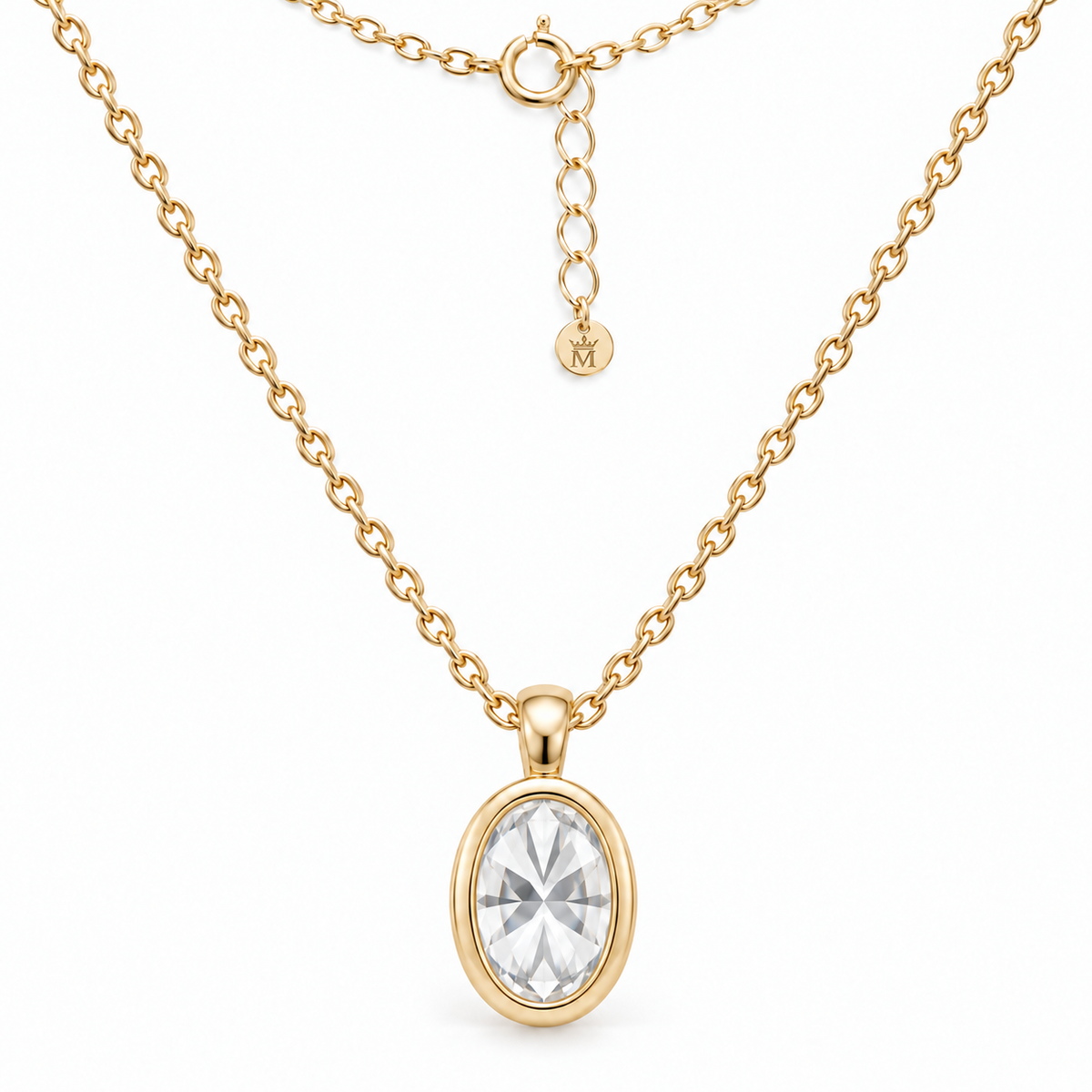 Reverse view of the 14K gold bezel pendant and bail. AI-edited crown-M engraving concept on the existing extender end disc; engraving and scale are illustrative.