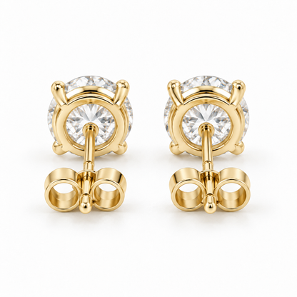 Back view of matched 14K gold diamond stud earrings and push-back closures.