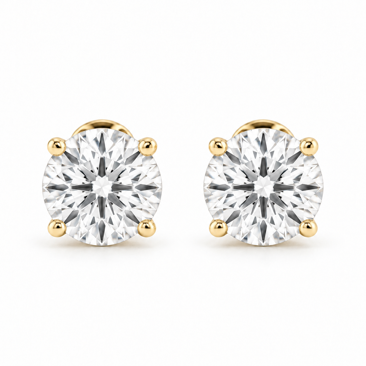 Front view of a matched pair of round lab-grown diamond stud earrings in 14K gold.