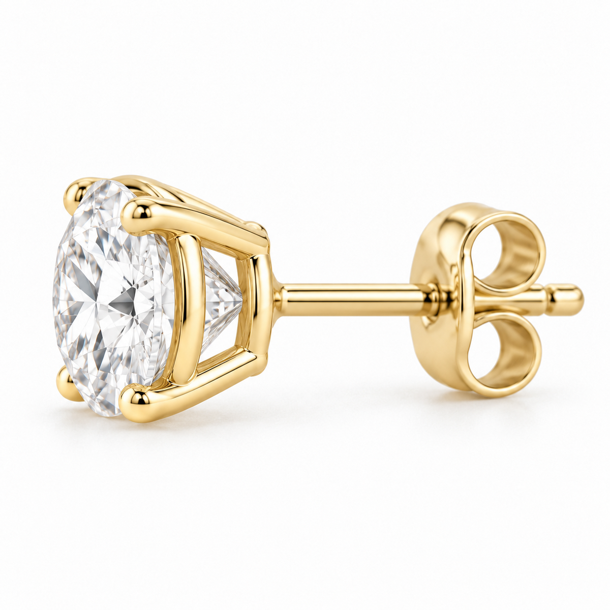 Side profile of a 14K gold four-prong round diamond stud earring with push-back post.