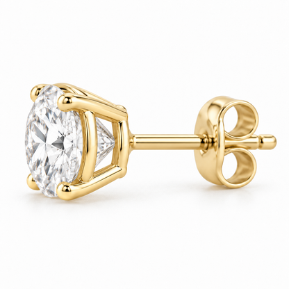 Side profile of a 14K gold four-prong round diamond stud earring with push-back post.