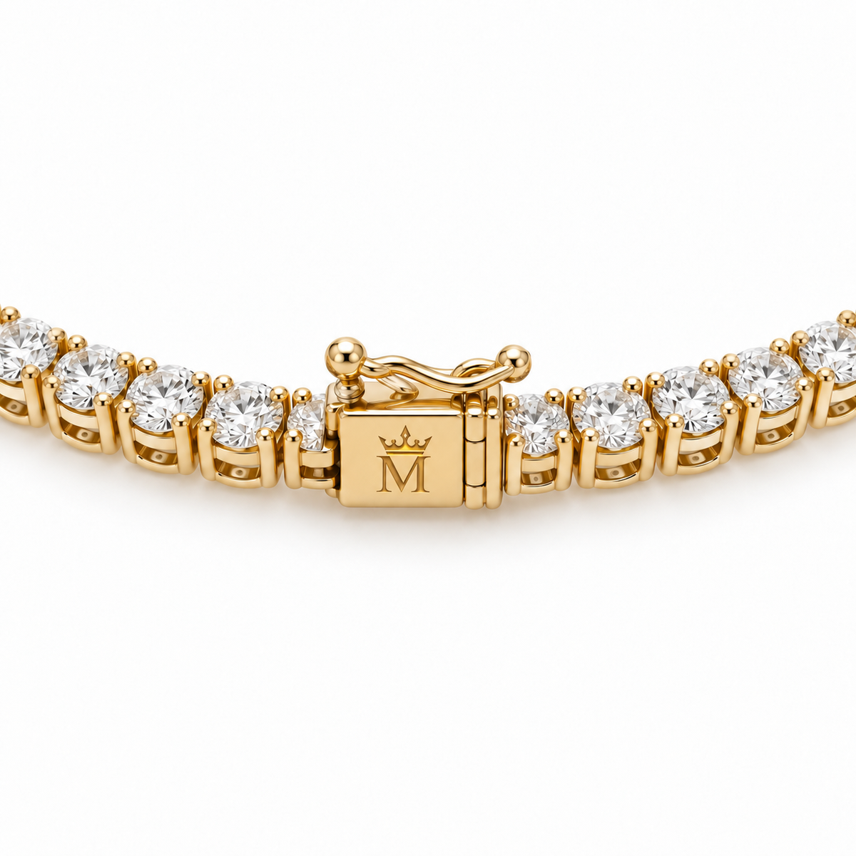 Close view of the tennis necklace box clasp and double safety latches. AI-edited crown-M engraving concept on the existing clasp face; engraving and scale are illustrative.