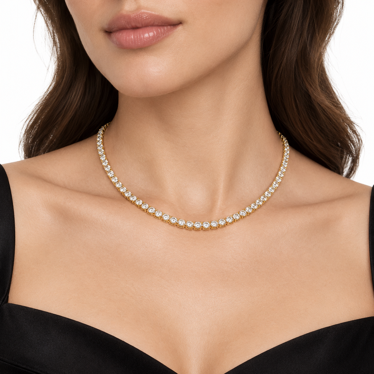 Petite diamond tennis necklace worn at the neckline, showing scale.
