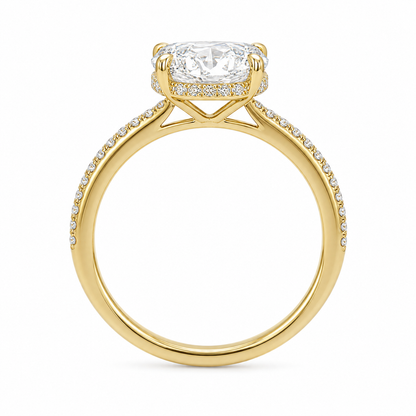 Left 45-degree view of an oval diamond ring showing the hidden halo and engraved inner band