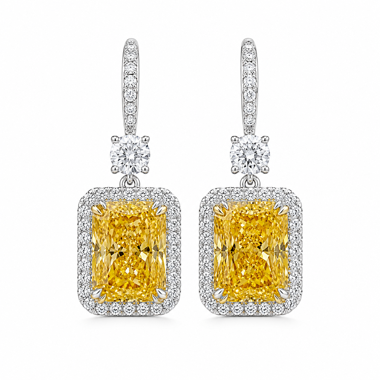 6 carat total fancy yellow radiant cut diamond drop earrings with diamond halo