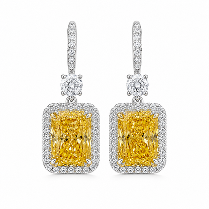 6 carat total fancy yellow radiant cut diamond drop earrings with diamond halo