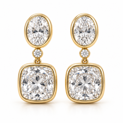 MISSISSI AA14 paired earrings in yellow gold tone, front view showing an oval diamond above one small round connector diamond and a cushion-shaped drop in rounded bezels; design visualization