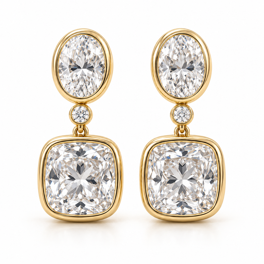 MISSISSI AA14 paired earrings in yellow gold tone, front view showing an oval diamond above one small round connector diamond and a cushion-shaped drop in rounded bezels; design visualization