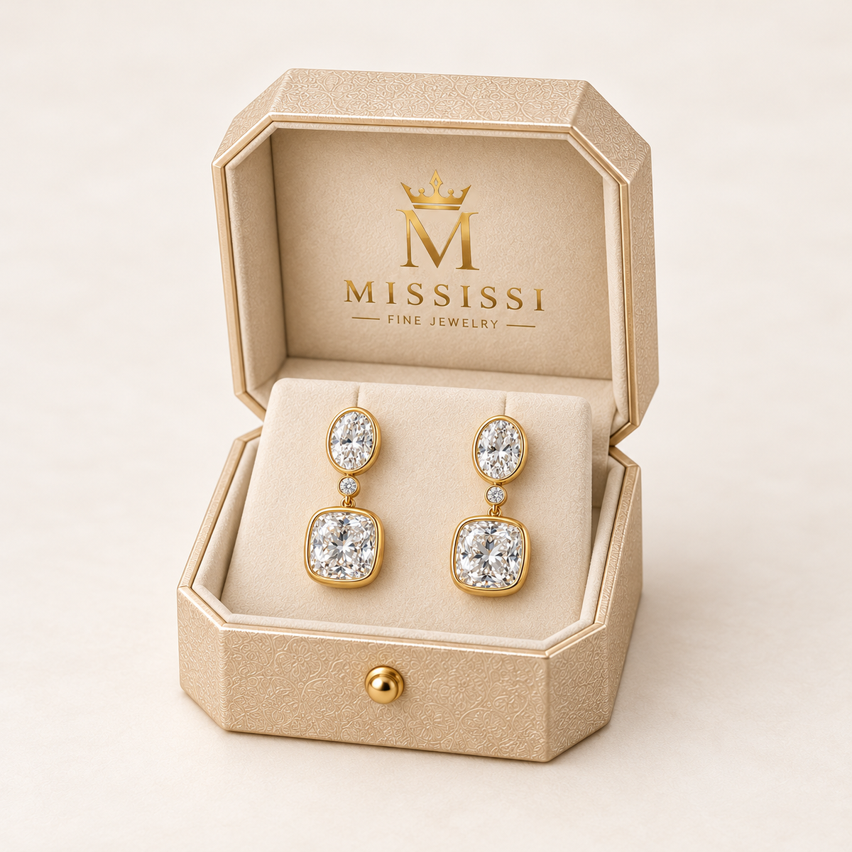 MISSISSI Floating Pebbles lab-grown diamond drop earrings in yellow gold, presented as a pair in champagne octagonal packaging with crown M branding; design visualization.