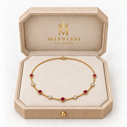 MISSISSI Scarlet Stations lab-grown ruby necklace in yellow gold, presented in champagne octagonal packaging with crown M branding; design visualization.