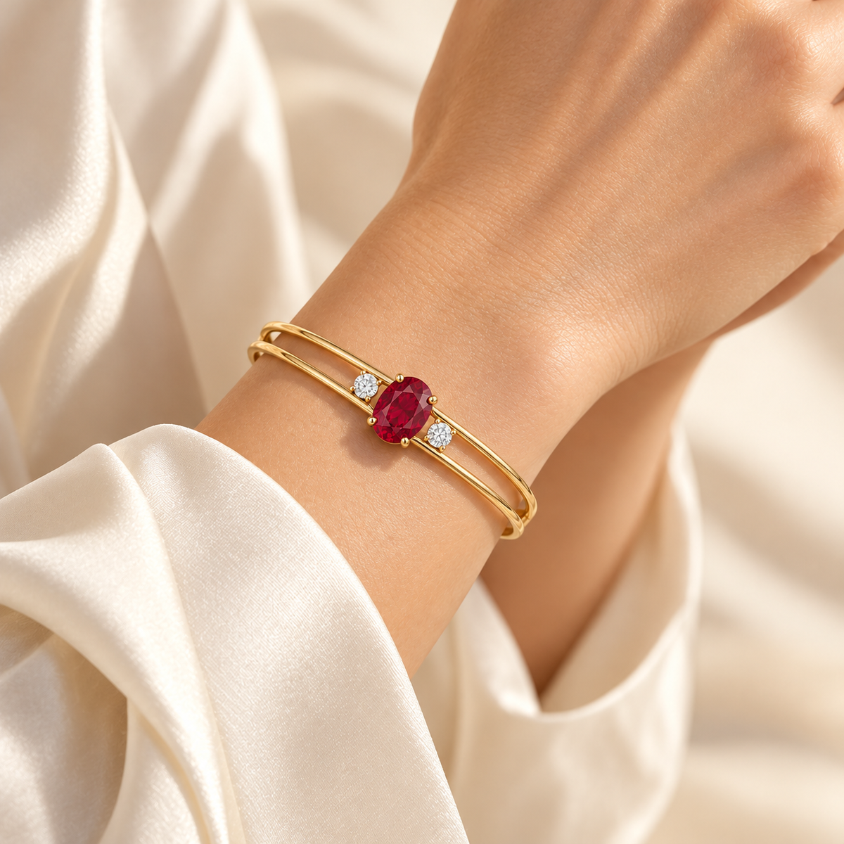 MISSISSI H26-RB01 yellow gold double-rail bangle with an oval lab-grown ruby and two round lab-grown diamonds. Natural wrist wearing visualization.; design visualization