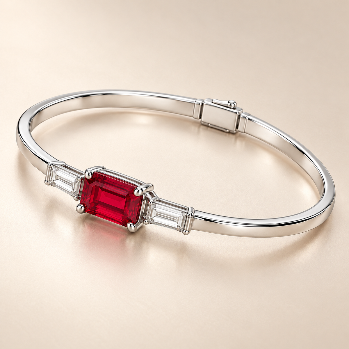 MISSISSI H26-RB02 white gold bangle with an east-west emerald-cut lab-grown ruby and two baguette lab-grown diamonds. Complementary angle on champagne background.; design visualization