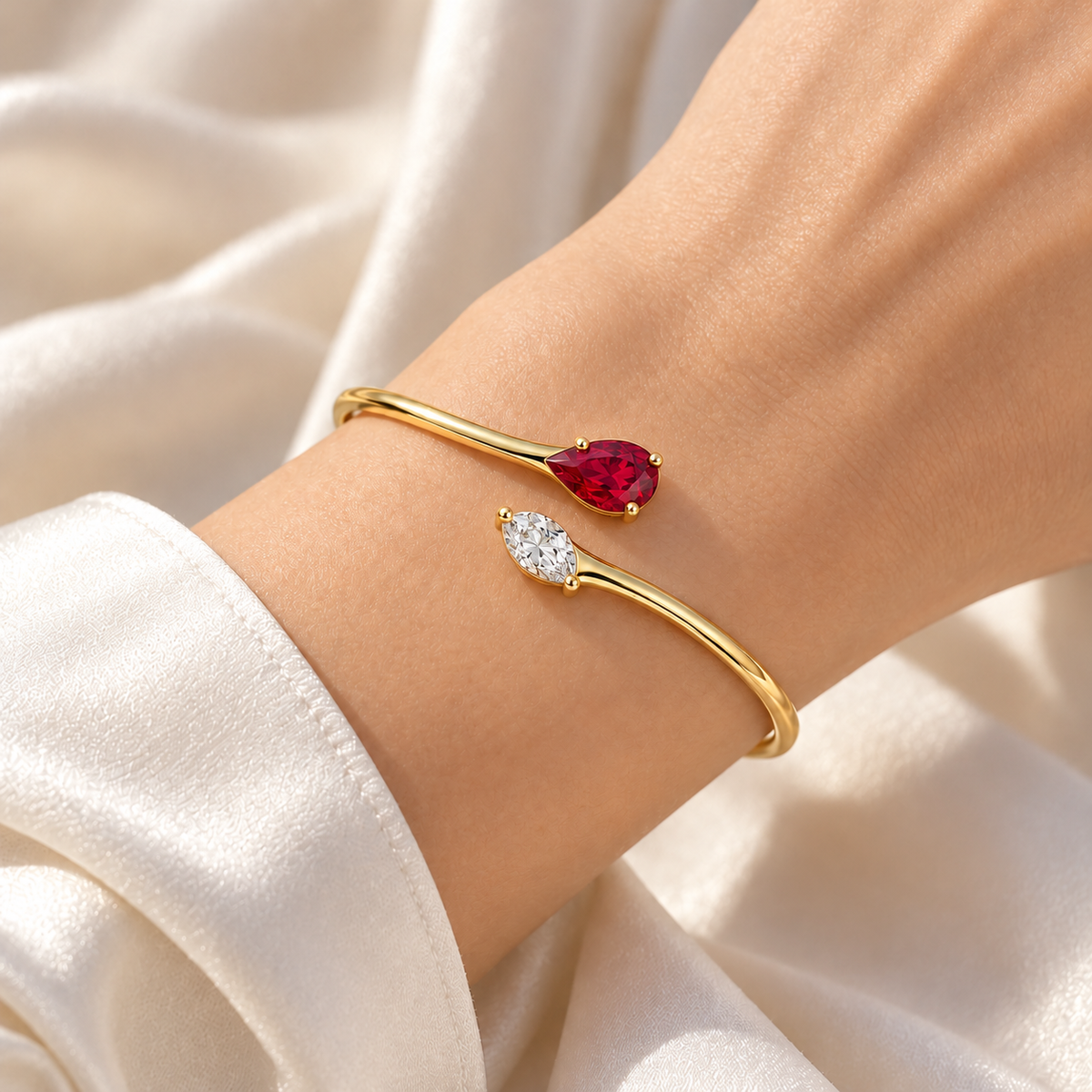 MISSISSI H26-RB03 yellow gold bypass bangle with red lab-grown ruby and white lab-grown diamond tips. Natural wrist wearing visualization.; design visualization