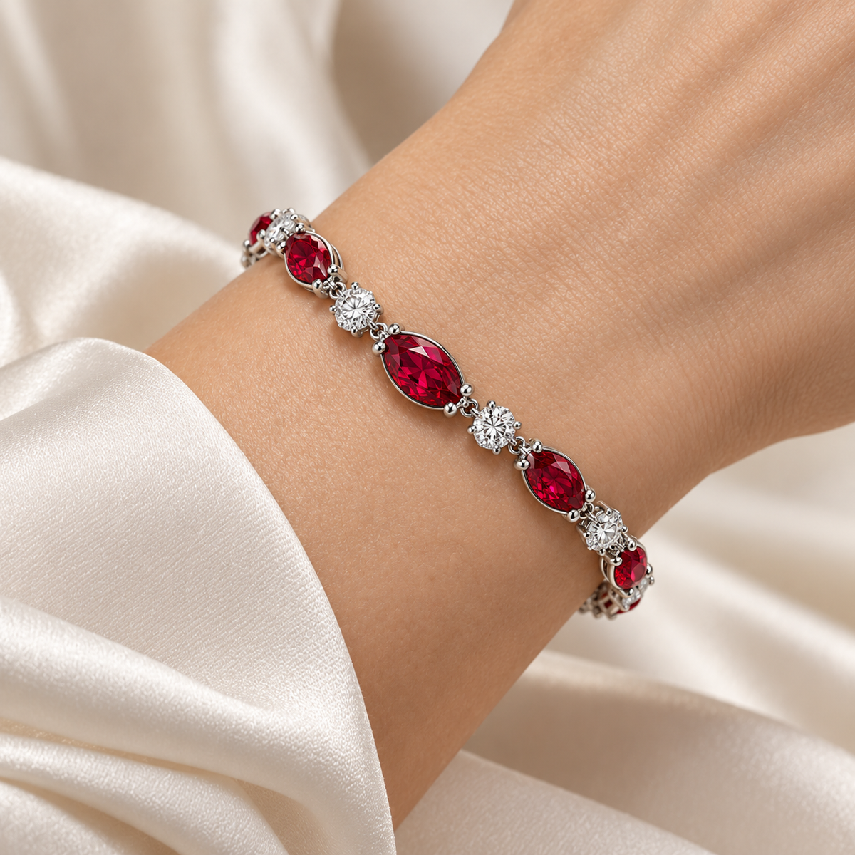 MISSISSI H26-RB04 white gold articulated bracelet with nine graduated marquise lab-grown rubies and ten round lab-grown diamonds. Natural wrist wearing visualization.; design visualization