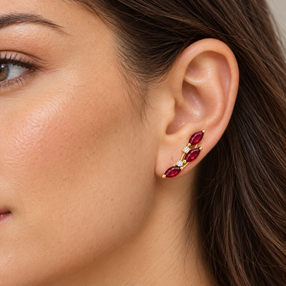 Adult model wearing one RE03 marquise ruby ear climber naturally along the lower ear; design visualization