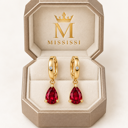 RE05 pear ruby huggie earring pair in champagne octagonal MISSISSI packaging; design visualization