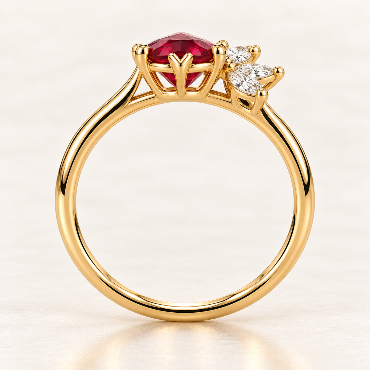 MISSISSI Crimson Feather pear-shaped lab-grown ruby ring in yellow gold with three marquise lab-grown diamond accents, side setting visualization.
