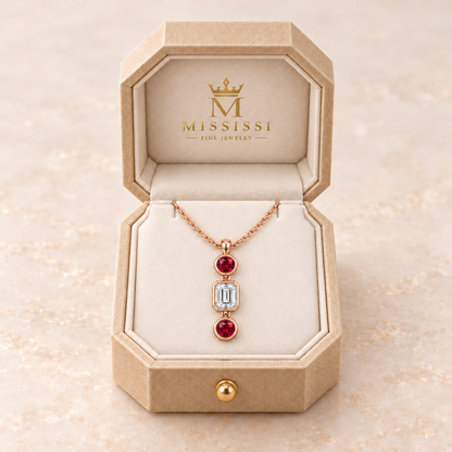 MISSISSI Scarlet Column lab-grown ruby necklace in rose gold, presented in champagne octagonal packaging with crown M branding; design visualization.