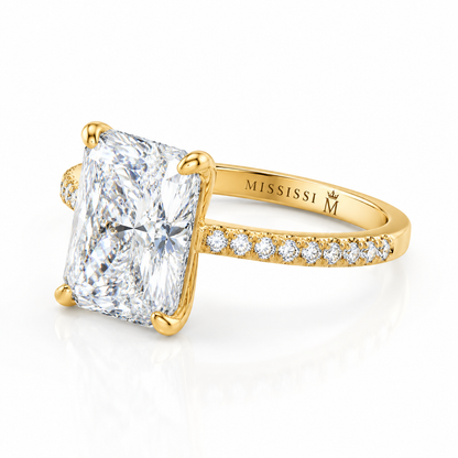 Side view showing the craftsmanship and pavé setting of a 6 carat radiant cut diamond ring