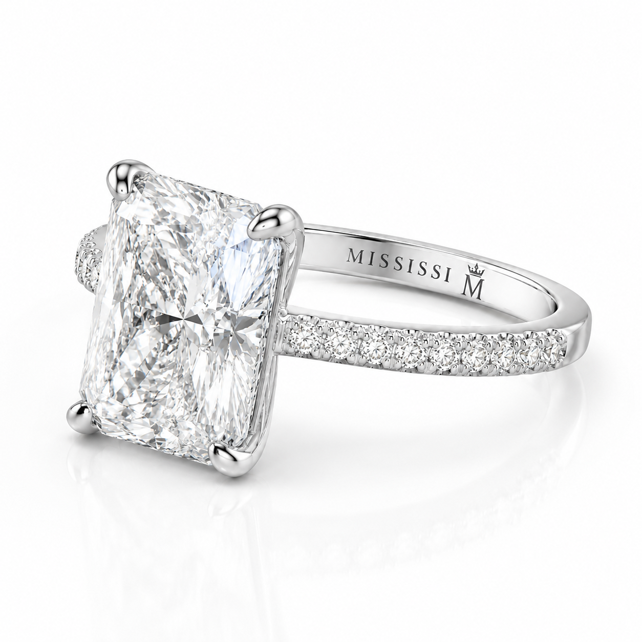 Side view showing the craftsmanship and pavé setting of a 6 carat radiant cut diamond ring
