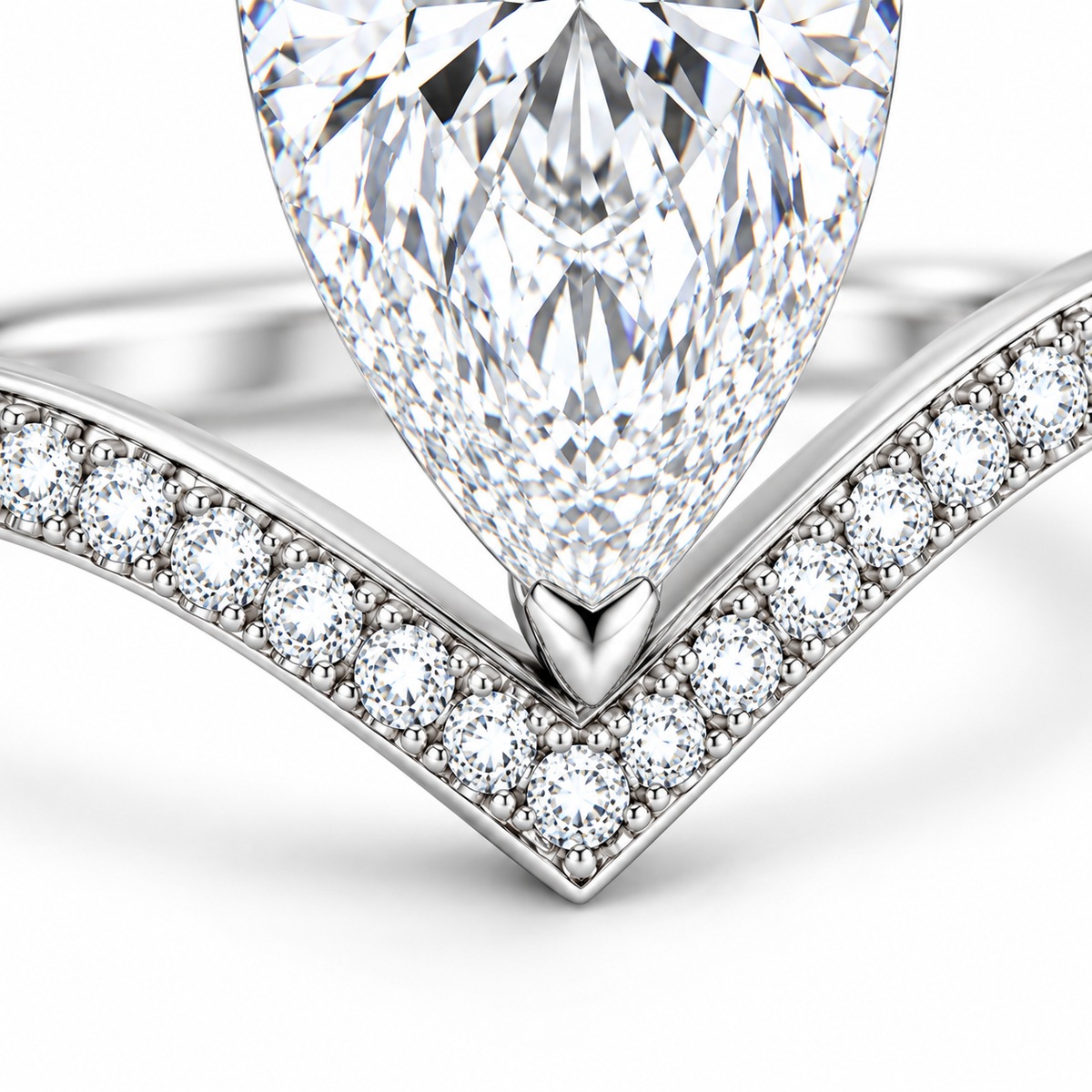 MISSISSI 1 Carat Pear-Shaped Lab-Grown Diamond Ring | E/VVS, IGI, 9K White Gold, pear-shaped diamond and tip-prong close-up. Design visualization.