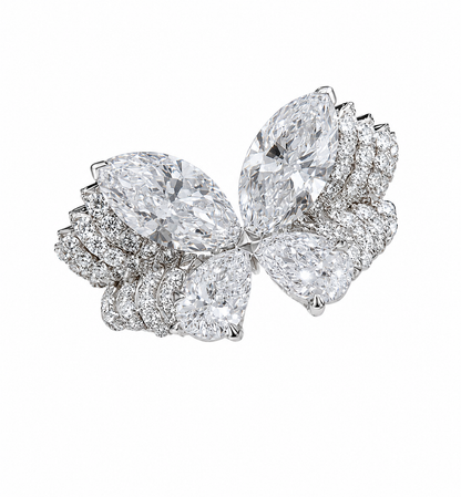 A sculptural butterfly diamond ring featuring two 3-carat marquise-cut diamonds and two 2-carat pear-cut diamonds, creating 10 carats across the four featured stones. The four diamonds form luminous butterfly wings above a wide, multi-row pavé-set band.