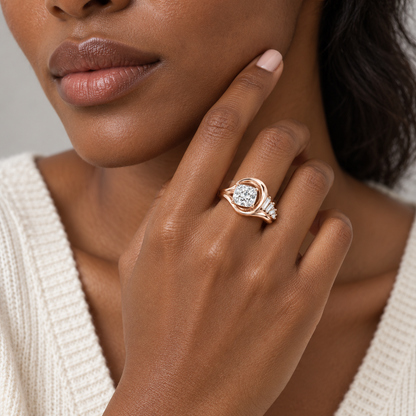 Tidal pale rose-gold ring shown on a hand near the jawline with an ivory knit top, design visualization.