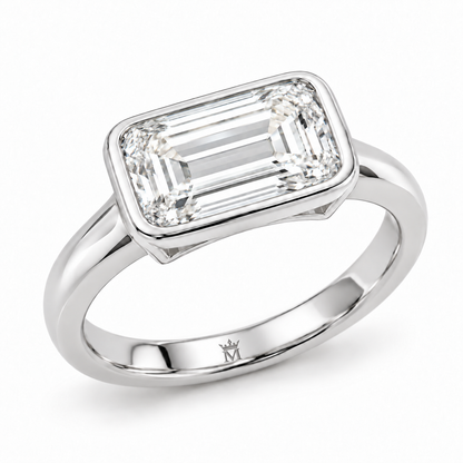 MISSISSI horizon east west ring angled view. AI-edited crown-M engraving concept inside the lower band; engraving and scale are illustrative.