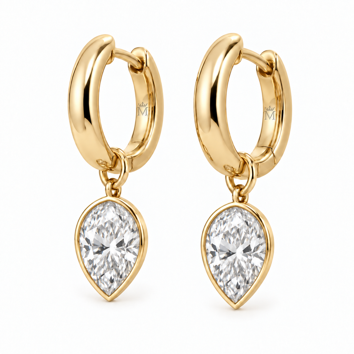 A pair of polished hinged huggies with bezel-set pear diamond drops. Each earring features a 0.50 carat pear diamond for a combined diamond weight of 1.00 carat per pair. AI-edited crown-M engraving concept on visible inner rear hoop surfaces; engraving and scale are illustrative.