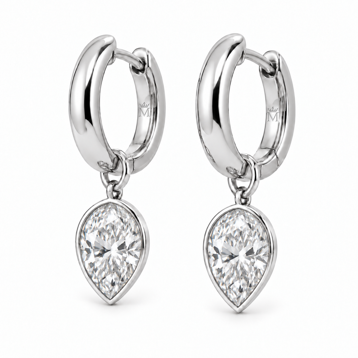 MISSISSI aurelle pear drop huggies in 14K white gold. AI-edited crown-M engraving concept on visible inner rear hoop surfaces; engraving and scale are illustrative.