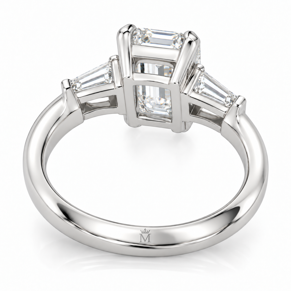AI-generated design concept of an emerald cut ring, bottom. Illustrative geometry and scale; not a manufactured product photograph. Crown-M engraving design is shown inside the lower band; engraving is illustrative.