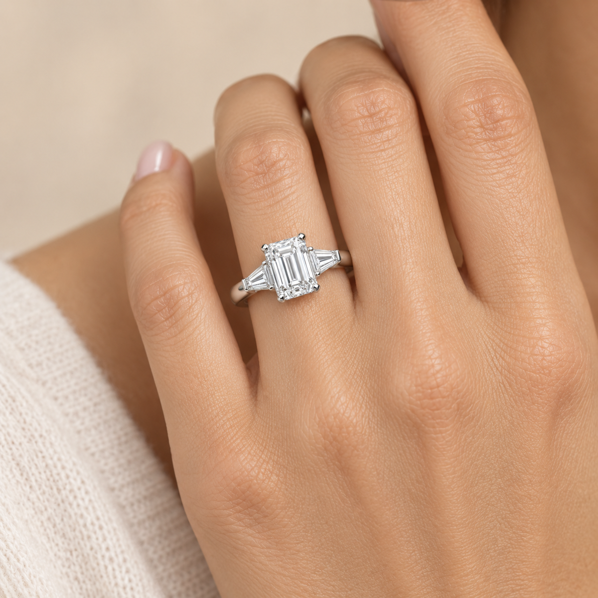 AI-generated design concept of an emerald cut ring, on hand. Illustrative geometry and scale; not a manufactured product photograph.