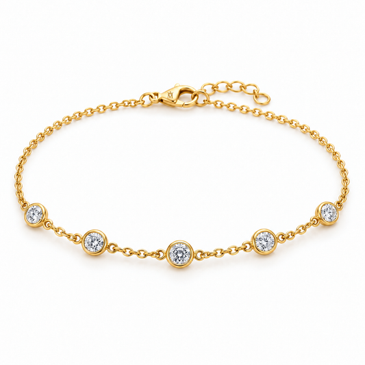Five round lab-grown diamonds, each weighing 0.10 carat, sit in individual full bezel stations along a fine cable chain. A plain chain at the back and a lobster clasp complete the restrained design. AI-edited crown-M engraving concept on the existing lobster clasp shell; engraving and scale are illustrative.