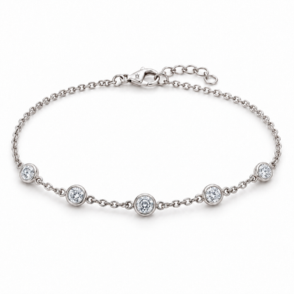 MISSISSI constellation station bracelet in 14K white gold. AI-edited crown-M engraving concept on the existing lobster clasp shell; engraving and scale are illustrative.