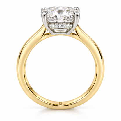 AI-generated design concept of an elongated cushion brilliant ring, side. Illustrative geometry and scale; not a manufactured product photograph. Crown-M engraving design is shown inside the lower band; engraving is illustrative.