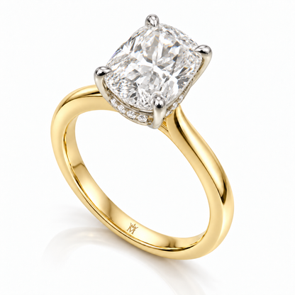 AI-generated design concept of an elongated cushion brilliant ring, opposite three quarter. Illustrative geometry and scale; not a manufactured product photograph. Crown-M engraving design is shown inside the lower band; engraving is illustrative.