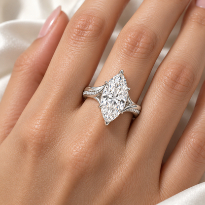 AI design preview of Liquid Crest marquise ring worn on an adult hand; scale illustrative