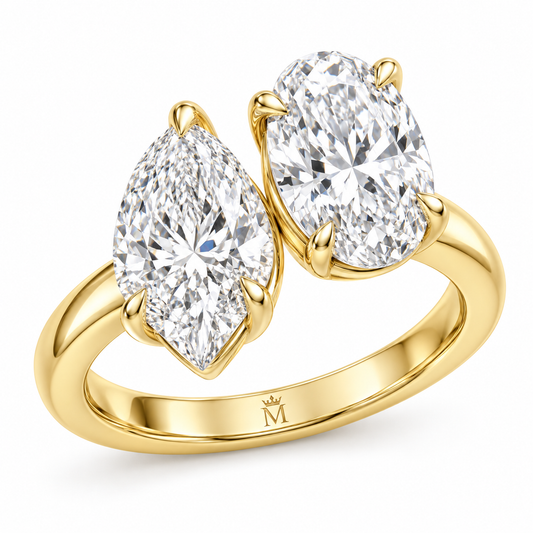Amour pear and oval Toi et Moi engagement ring in 14K yellow gold, on a clean white background, front hero view.