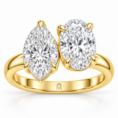 Amour pear and oval Toi et Moi engagement ring in 14K yellow gold, close-up of the diamond setting.