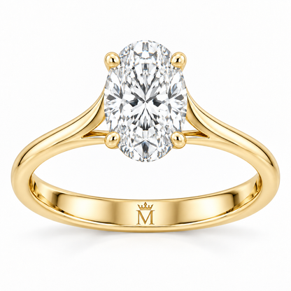 Aurelia oval lab-grown diamond solitaire ring in 14K yellow gold, interior crowned-M hallmark detail.