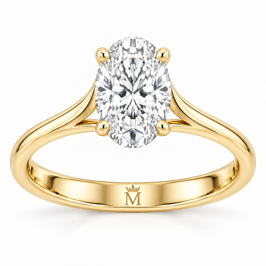 Aurelia oval lab-grown diamond solitaire ring in 14K yellow gold, interior crowned-M hallmark detail.