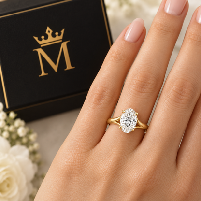 Aurelia oval lab-grown diamond solitaire ring in 14K yellow gold, worn by a model.