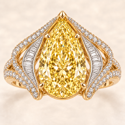 Solar Rhapsody yellow pear-shaped diamond ring with white baguette and pavé accents, top view