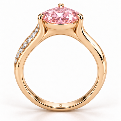 AI design preview of Blush Current pink pear ring in profile with compact closed gallery and discreet inner crowned-M engraving