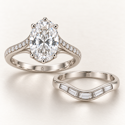 AI design preview of the two separate CONFLUENCE rings: oval engagement ring and curved five-baguette band with crowned-M inner engravings