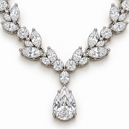 Close view of Willow Drop necklace focal pear diamond, connector and marquise leaf settings