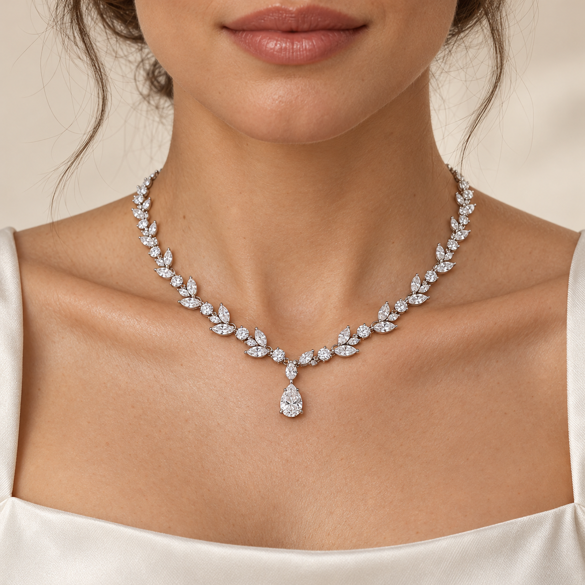 Adult model with light skin wearing the Willow Drop lab-grown diamond necklace