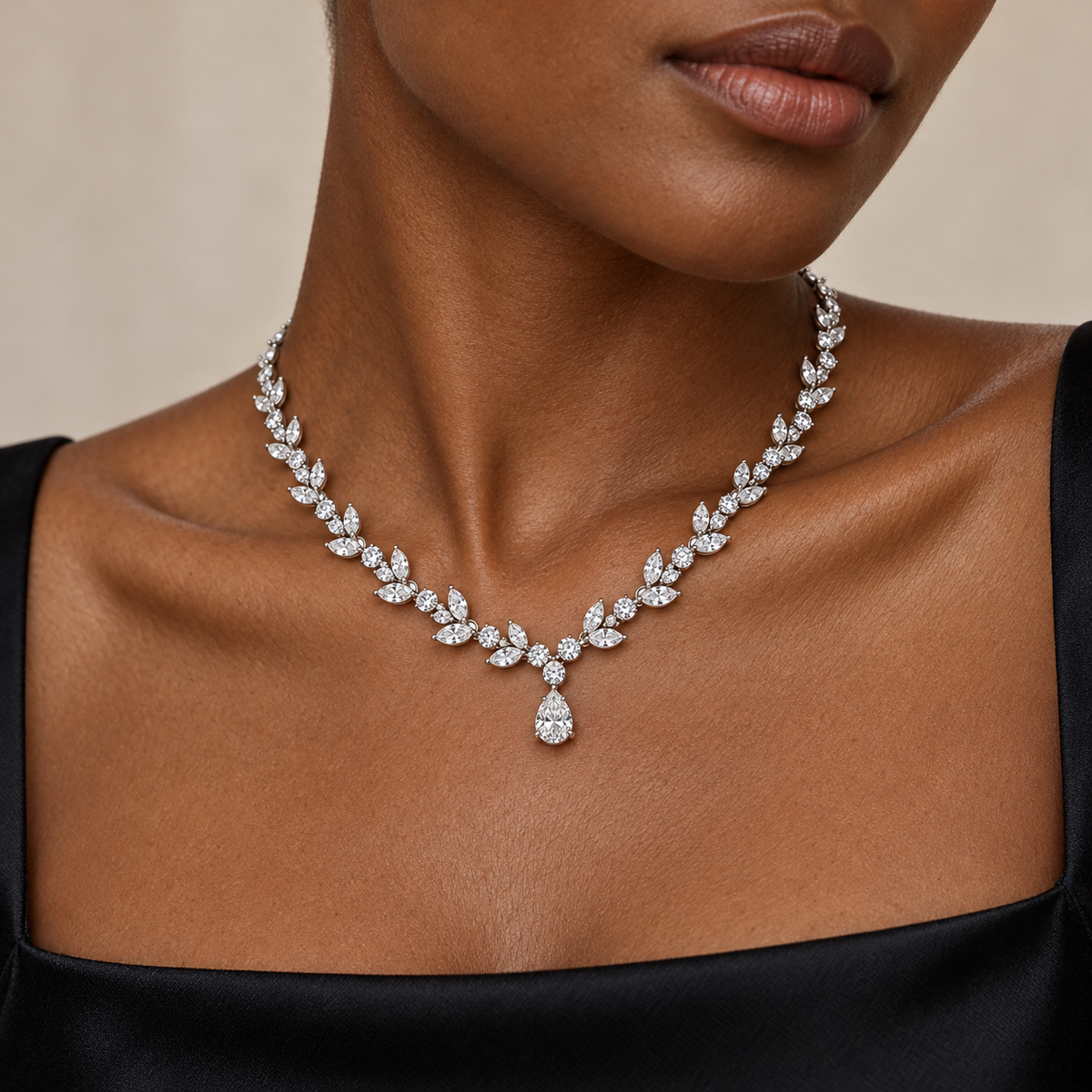 Adult model with deep skin wearing the Willow Drop lab-grown diamond necklace